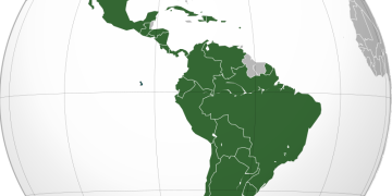 Latin America (orthographic projection). In grey Canada, USA, Belize, Guyana, Suriname, Trinidad and Tobago, Jamaica, the Bahamas, the Falklands
